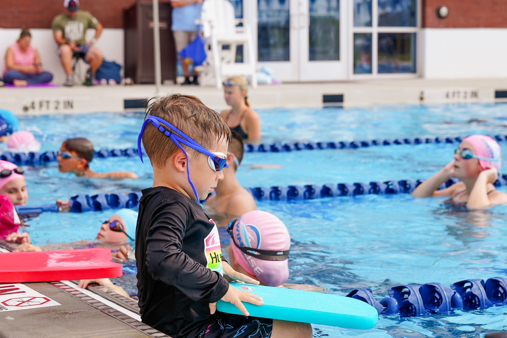 Private swimming lesson with instructor and student